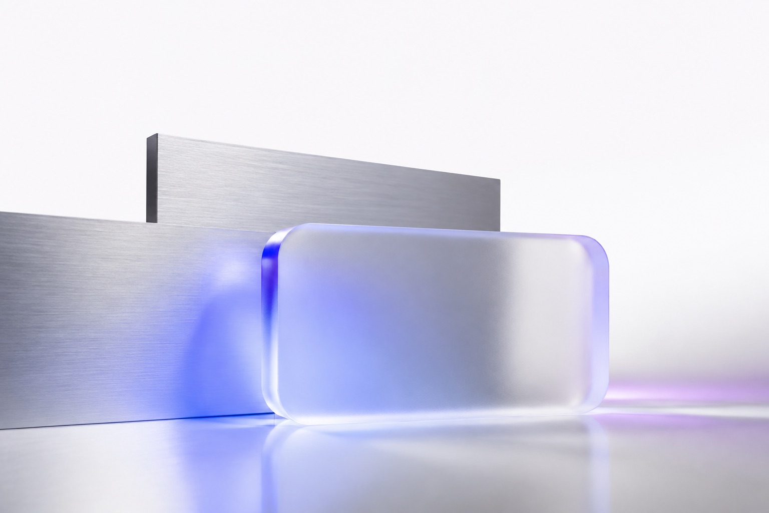 Abstract glass and aluminium forms with soft coloured light